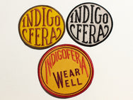Indigofera Wear well round badge