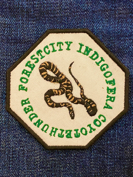 Indigofera Forest City badge